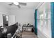 Bright bedroom featuring neutral walls, ceiling fan, and large window with natural light at 614 Becklow St, Debary, FL 32713