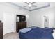 Bedroom featuring a bed, dresser, and access to the ensuite bathroom at 614 Becklow St, Debary, FL 32713