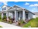 Charming single-story home with a well-manicured lawn and inviting front porch with landscaping at 614 Becklow St, Debary, FL 32713