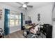 Bright home office with large window, modern desk setup, and neutral decor at 614 Becklow St, Debary, FL 32713