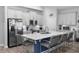 Modern kitchen featuring white cabinets, stainless steel appliances, and a large center island at 614 Becklow St, Debary, FL 32713