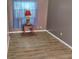 Bedroom with a striking red lamp and hardwood flooring, creating a cozy and stylish space at 615 Weber Ave, Daytona Beach, FL 32114