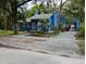 Charming blue home featuring well-kept landscaping and a welcoming front entrance at 615 Weber Ave, Daytona Beach, FL 32114