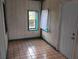 Room with wood tile flooring, large window, and closet at 615 Weber Ave, Daytona Beach, FL 32114