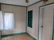Bright room with tile floors, window, and door, perfect for an office at 615 Weber Ave, Daytona Beach, FL 32114