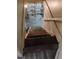 View of the staircase leading down to the basement with wooden steps and a handrail at 615 Weber Ave, Daytona Beach, FL 32114