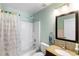 Bathroom with shower/tub combination, neutral walls and vanity with sink at 685 N Firwood Dr, Deltona, FL 32725