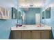 Bathroom featuring a double sink vanity, large mirror and plenty of counter space at 685 N Firwood Dr, Deltona, FL 32725