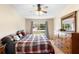 Bedroom featuring wood floors, natural light and neutral paint at 685 N Firwood Dr, Deltona, FL 32725