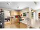 Cozy kitchen with light cabinets, a breakfast bar, and stainless steel appliances at 685 N Firwood Dr, Deltona, FL 32725