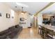 Open-concept living room featuring tile floors and access to kitchen and front entry at 685 N Firwood Dr, Deltona, FL 32725