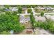 Aerial shot showing the property with neutral siding, a lush green yard, and a suburban setting at 685 N Firwood Dr, Deltona, FL 32725