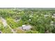Aerial view of home surrounded by lush trees and greenery at 710 W May St, Deland, FL 32720