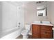 Bathroom with white subway tile surrounding the tub and a wood vanity at 710 W May St, Deland, FL 32720