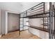 Bedroom featuring a unique metal loft bed frame with desk, plus closet at 710 W May St, Deland, FL 32720