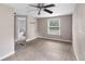 A bedroom with wood-look floors and a ceiling fan at 710 W May St, Deland, FL 32720