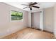 Bedroom with a ceiling fan, closet, and a window for natural light at 710 W May St, Deland, FL 32720