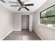 Bedroom featuring a ceiling fan, closet and bright window at 710 W May St, Deland, FL 32720