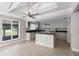 Kitchen featuring an open layout, kitchen island, and custom kitchen cabinets at 710 W May St, Deland, FL 32720