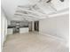 A bright and spacious living room featuring an open floor plan with tile flooring, and vaulted ceiling at 710 W May St, Deland, FL 32720