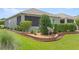 Backyard view showcasing landscaping, privacy hedges, and patio area; a tranquil outdoor space at 7732 Sw 86Th Ct, Ocala, FL 34481