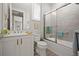 The bathroom features a shower-tub combination and a white vanity with fixtures and a mirror at 7732 Sw 86Th Ct, Ocala, FL 34481