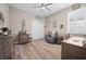 The office/bedroom is enhanced by a ceiling fan and shuttered window for a comfortable atmosphere at 7732 Sw 86Th Ct, Ocala, FL 34481