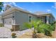 Charming single-story home showcasing a paver driveway, attached garage, and meticulously landscaped front yard at 7732 Sw 86Th Ct, Ocala, FL 34481