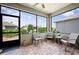 Relaxing screened-in porch with comfortable seating, perfect for enjoying the outdoor views at 7732 Sw 86Th Ct, Ocala, FL 34481
