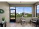 Inviting screened-in porch with comfortable chairs and a view of the well-maintained backyard at 7732 Sw 86Th Ct, Ocala, FL 34481