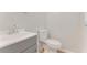 Well-lit half-bathroom features modern sink, faucet, fixtures, and toilet at 916 Kathy St, Daytona Beach, FL 32114