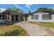 Charming single story house with a covered carport and driveway at 916 Kathy St, Daytona Beach, FL 32114