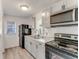 Updated kitchen featuring stainless steel microwave and black range at 916 Kathy St, Daytona Beach, FL 32114