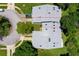 An aerial view shows the property, its roof, and surrounding well-maintained lawns and trees at 955 Grayling Ct # B, Port Orange, FL 32127