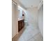 Bathroom featuring ample storage, tile flooring, vanity with a sink, and natural light at 955 Grayling Ct # B, Port Orange, FL 32127