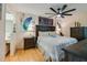 Serene bedroom features stylish decor with paintings, ceiling fan, and natural light creating a relaxing atmosphere at 955 Grayling Ct # B, Port Orange, FL 32127