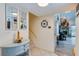 Inviting entryway featuring coastal decor, staircase access, and views into the living space at 955 Grayling Ct # B, Port Orange, FL 32127