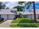 Inviting home featuring lush landscaping and a convenient driveway, perfect for comfortable living at 955 Grayling Ct # B, Port Orange, FL 32127