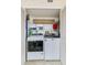 Convenient laundry room showcasing modern washer and dryer units with storage shelves at 955 Grayling Ct # B, Port Orange, FL 32127