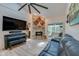 Inviting living room featuring a stone fireplace, piano, and comfortable seating perfect for relaxation and entertainment at 955 Grayling Ct # B, Port Orange, FL 32127