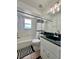 Bathroom featuring a tub with shower, a black and white shower curtain and a dark green vanity at 955 Thelma St, Orange City, FL 32763