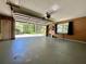 Spacious garage with an open door and ample room for storage and parking at 955 Thelma St, Orange City, FL 32763