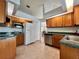 Traditional kitchen with wooden cabinets, stainless steel appliances, and tile flooring at 955 Thelma St, Orange City, FL 32763