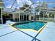 Inviting screened-in pool with blue water and a view of the lush backyard at 955 Thelma St, Orange City, FL 32763