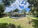 Backyard featuring a screened pool, providing a perfect blend of relaxation and recreation at 955 Thelma St, Orange City, FL 32763