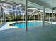 A refreshing pool surrounded by a screened enclosure, offering views of the backyard at 955 Thelma St, Orange City, FL 32763