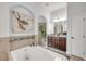 Bathroom with soaking tub and walk-in shower at 101 Briargate Look, Ormond Beach, FL 32174
