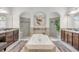 Elegant bathroom featuring a large soaking tub between dual vanities, and walk-in shower at 101 Briargate Look, Ormond Beach, FL 32174