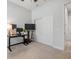 This bedroom features neutral carpet, a ceiling fan, and a desk at 101 Briargate Look, Ormond Beach, FL 32174