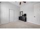 Bright bedroom features neutral carpet, ceiling fan, and a black dresser at 101 Briargate Look, Ormond Beach, FL 32174